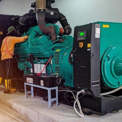 a-technician-is-doing-regular-maintenance-on-the-generator-engine-free-photo